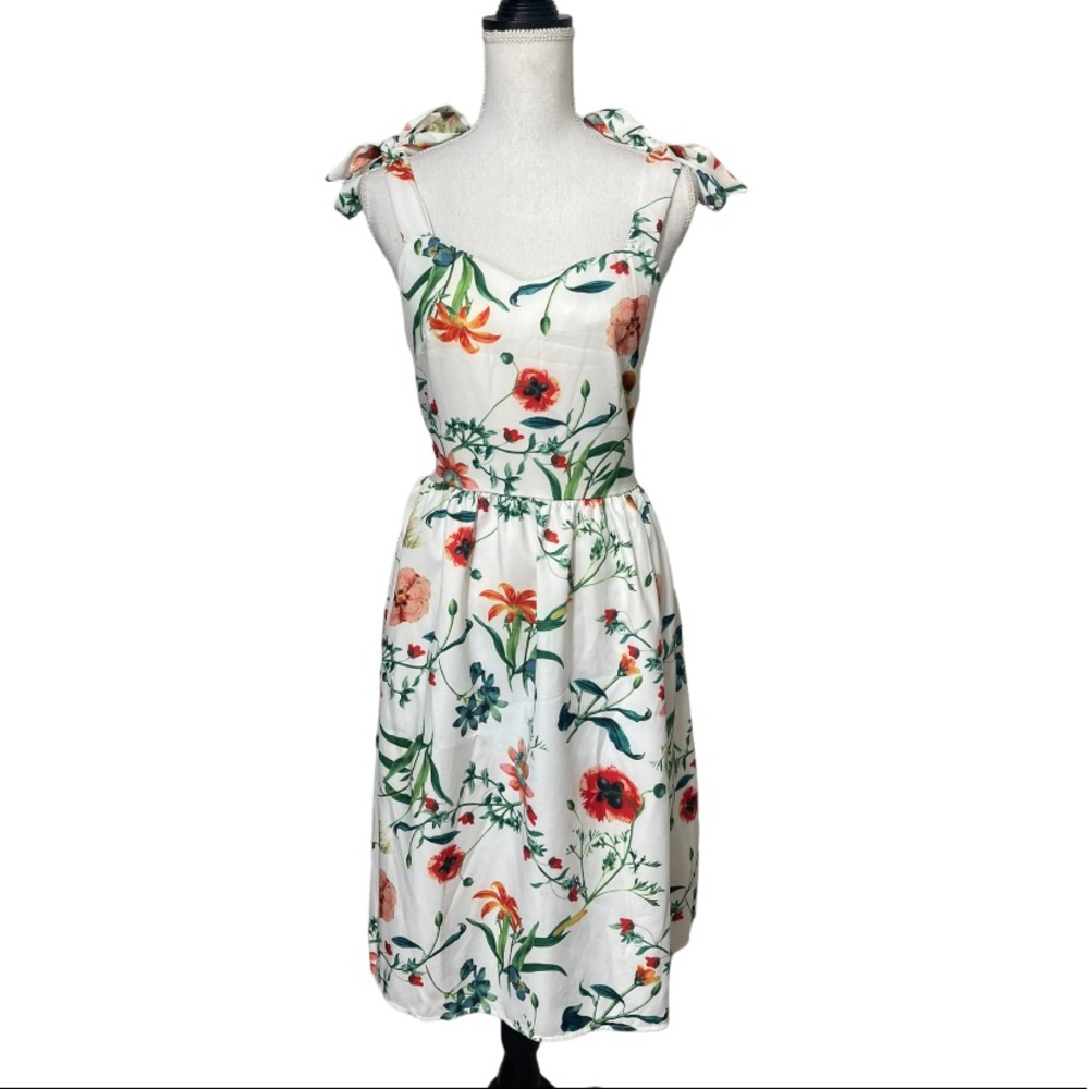 Gorgeous floral dress with bow shoulders.